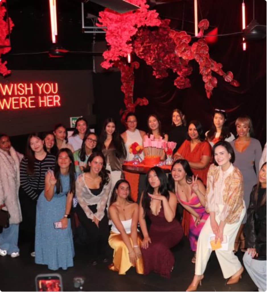 Community members celebrating together at a decorated group event